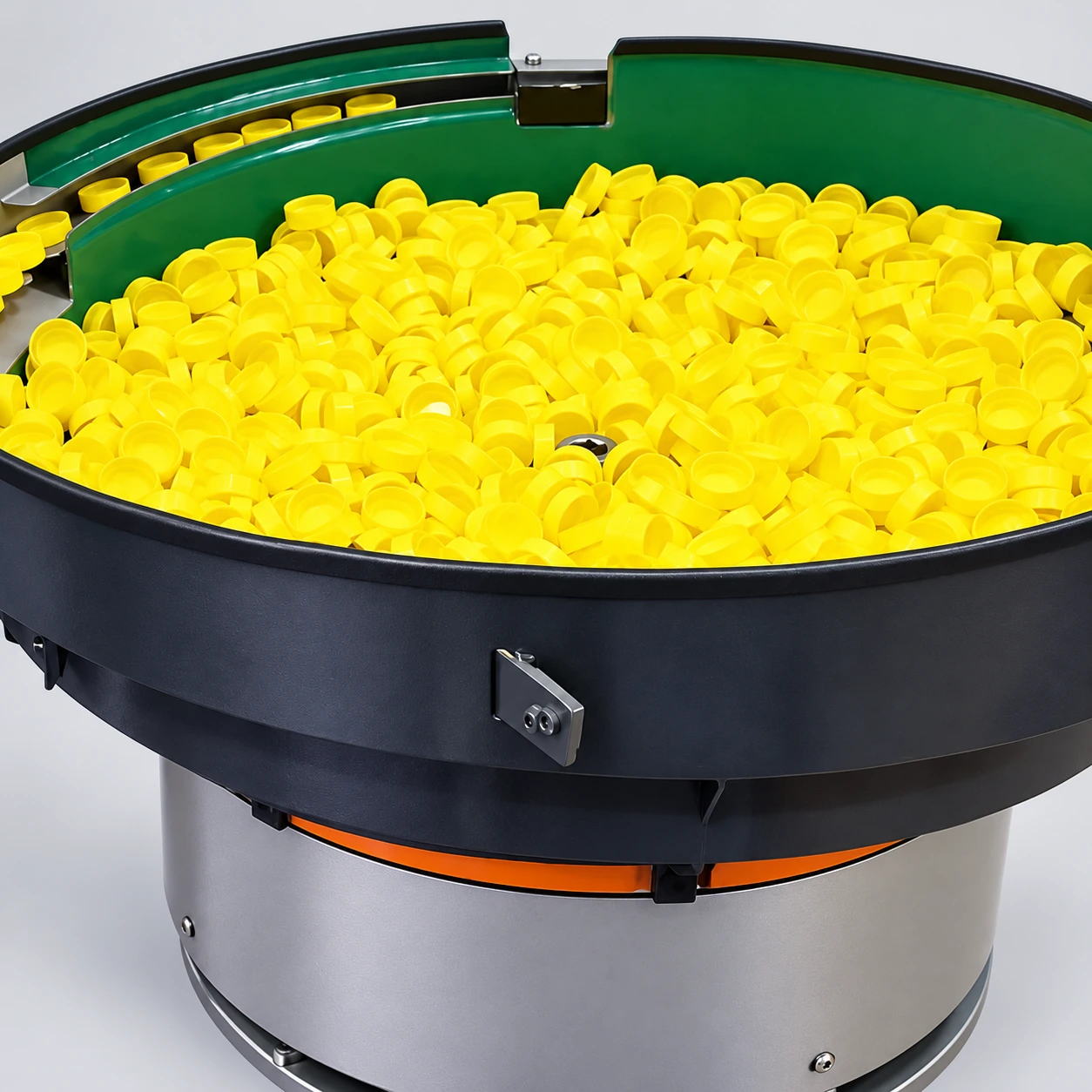 Yellow plastic components in an orientation bowl